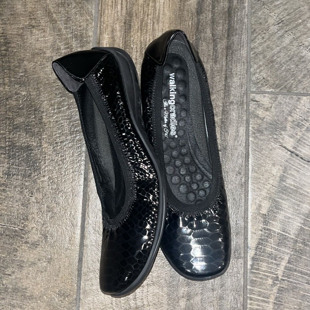 Walking Cradles( It’s a matter of fit) black leather there reptile print.